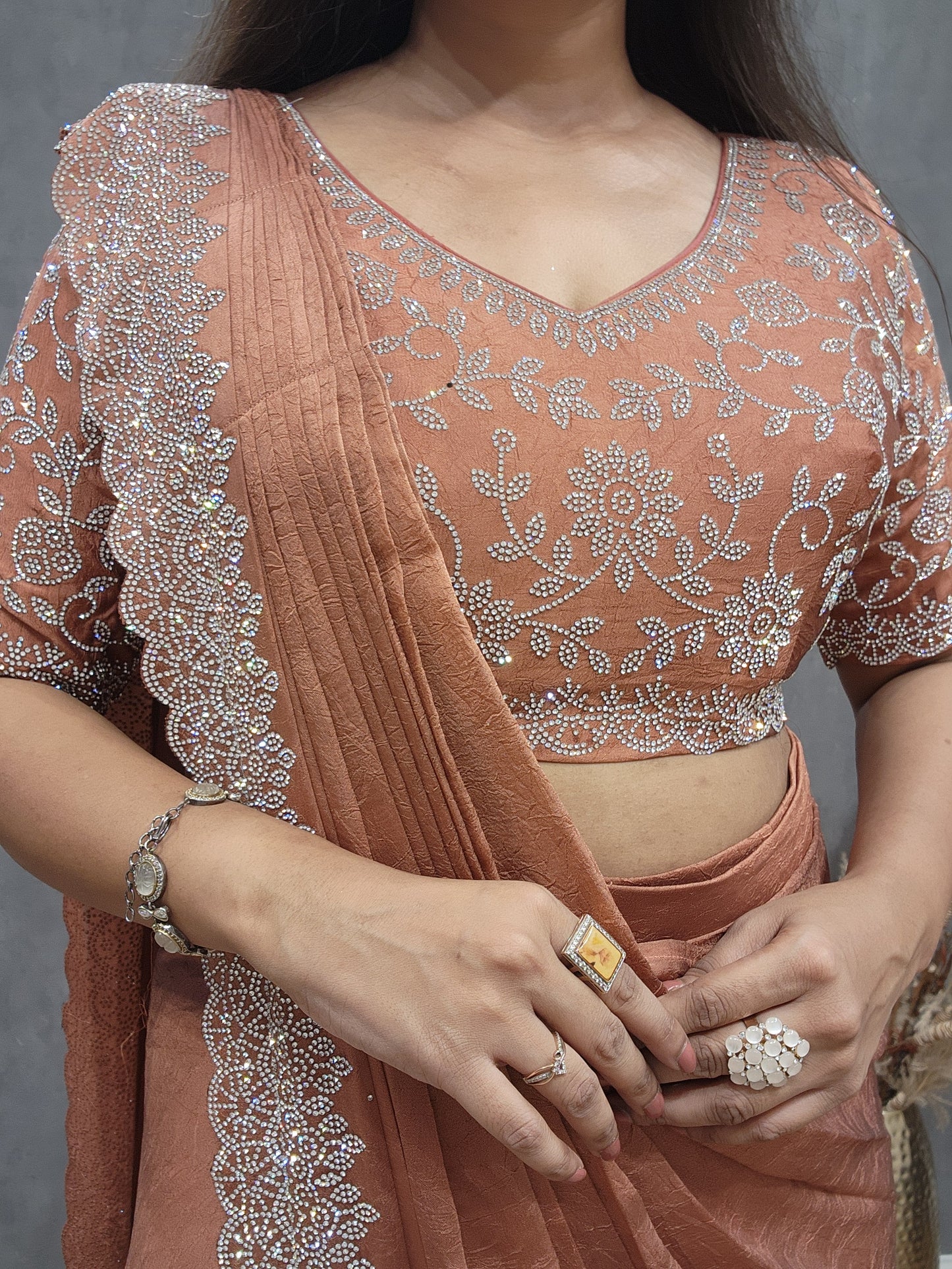 Burnt orange crepe siroski saree