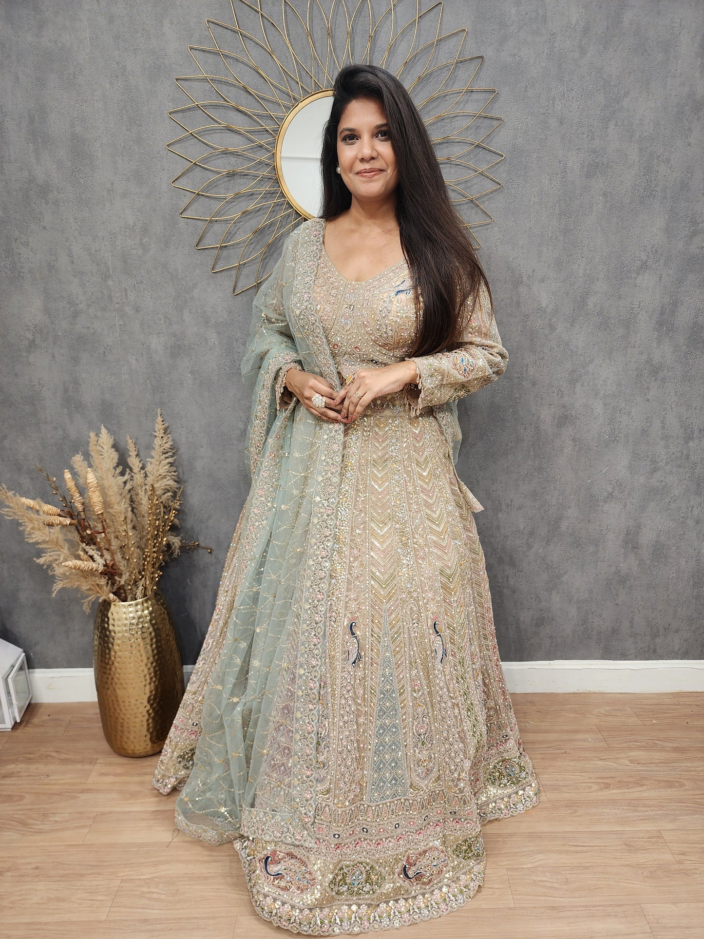 Peacock aariwork net lehenga with sky dupatta