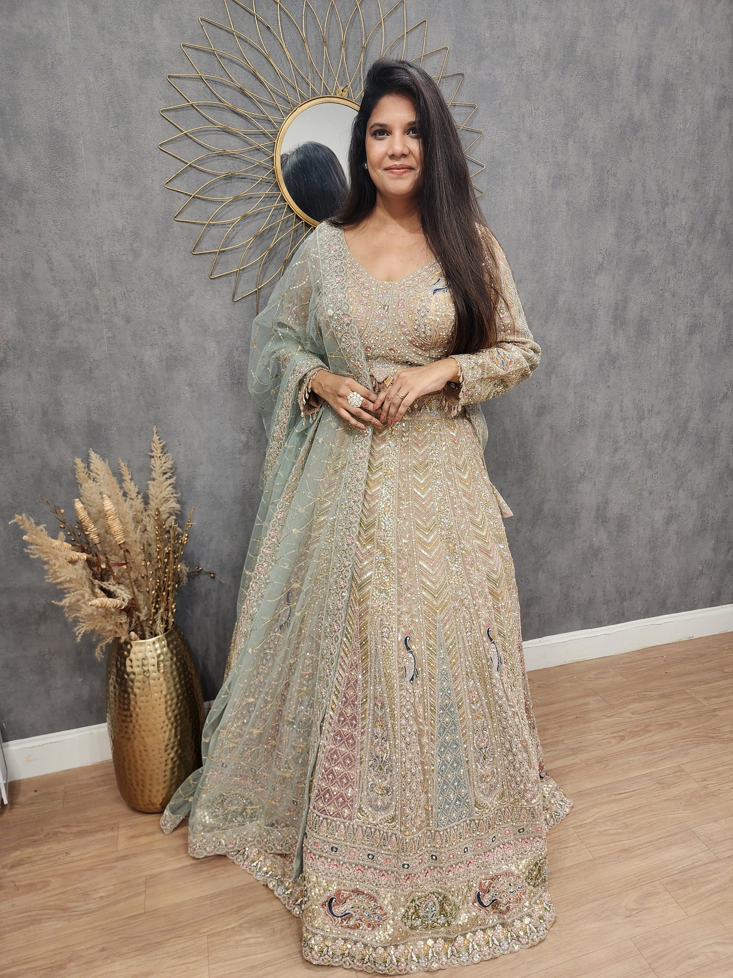 Peacock aariwork net lehenga with sky dupatta
