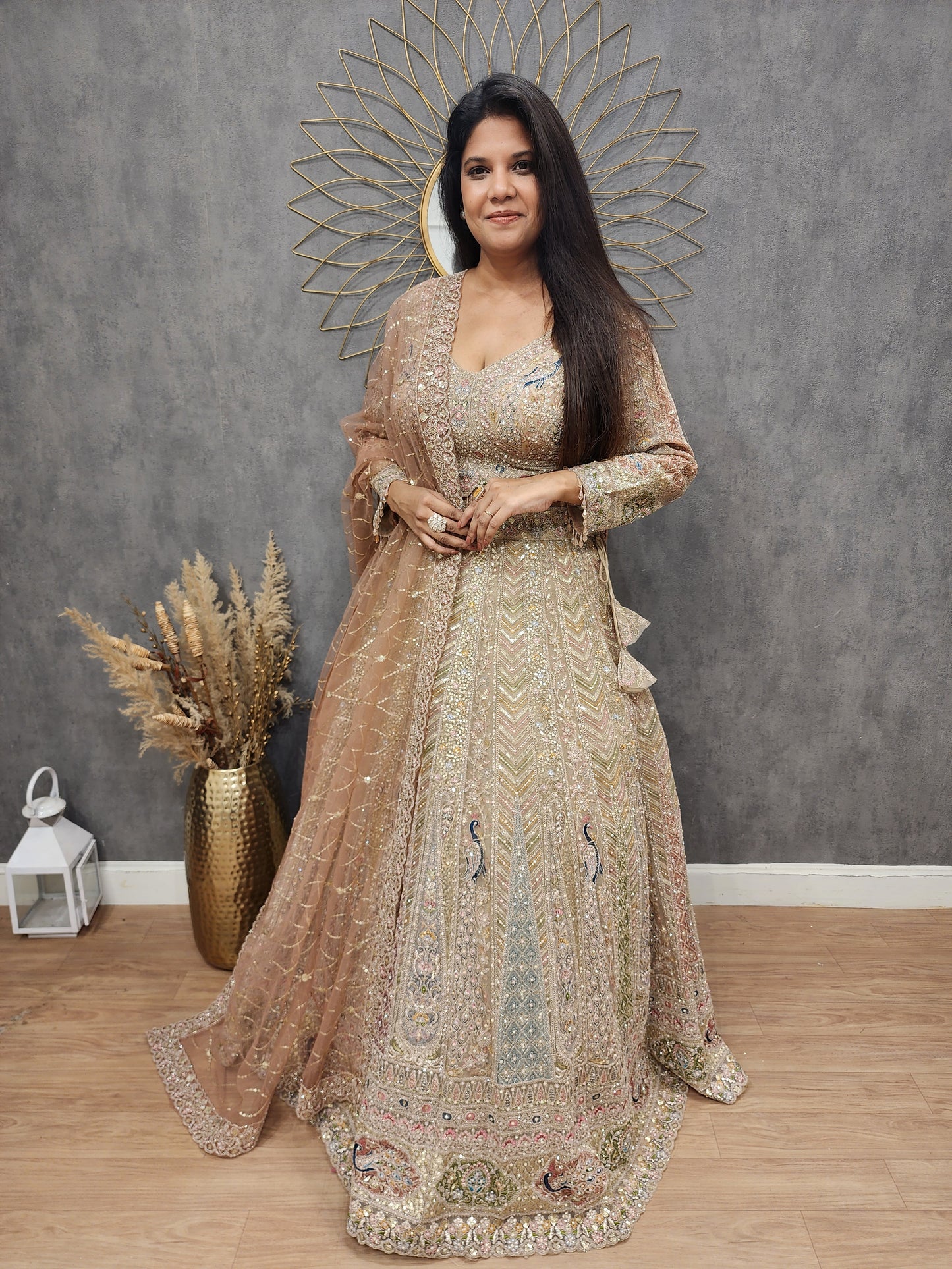 Peacock aariwork net lehenga with peach dupatta