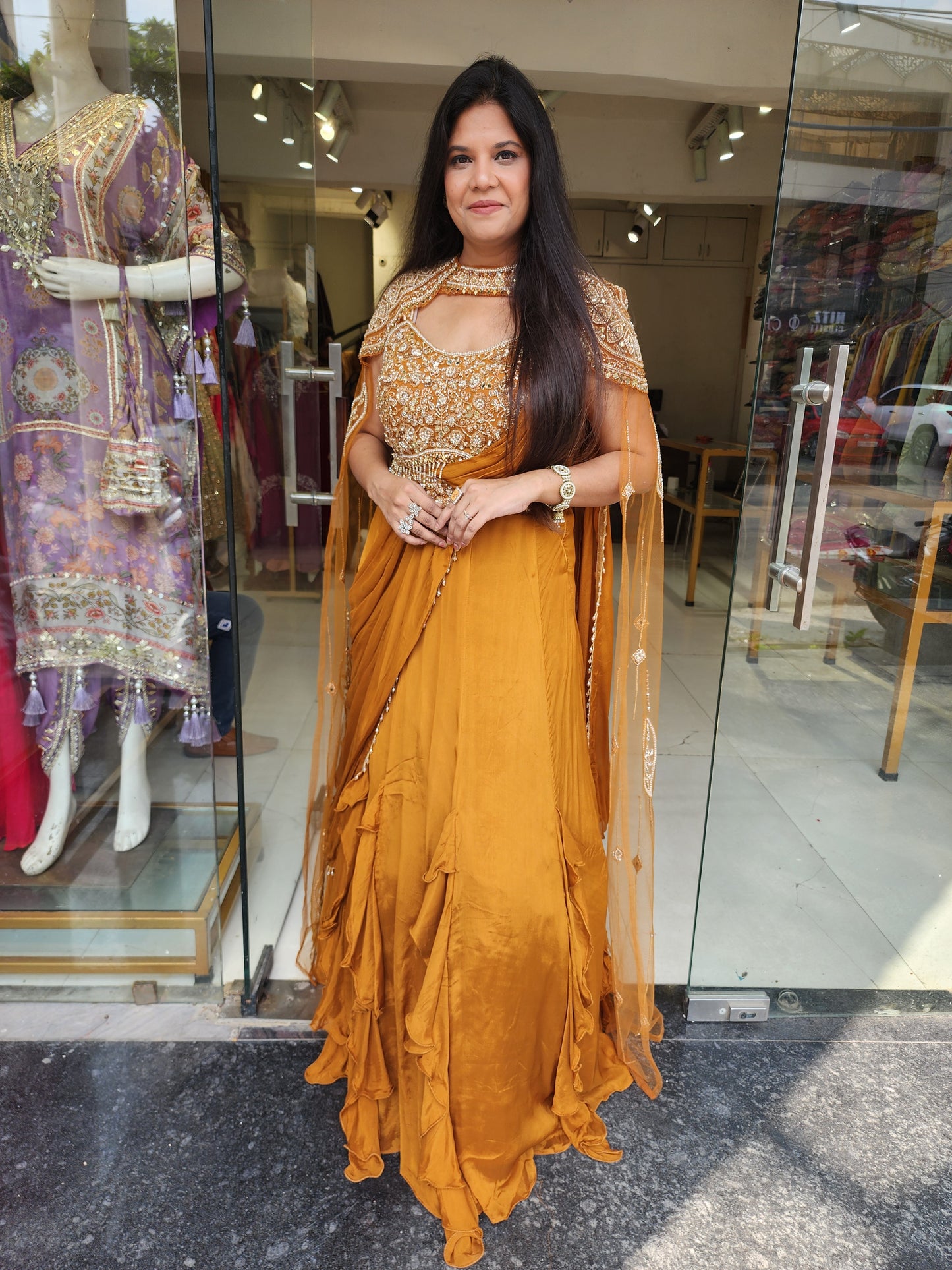 Golden orange drape lehemga with cape