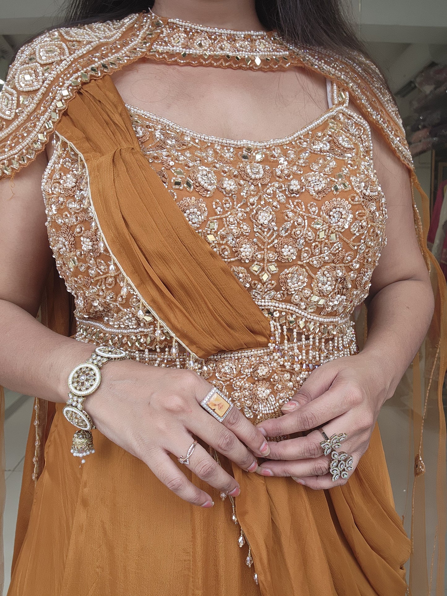 Golden orange drape lehemga with cape