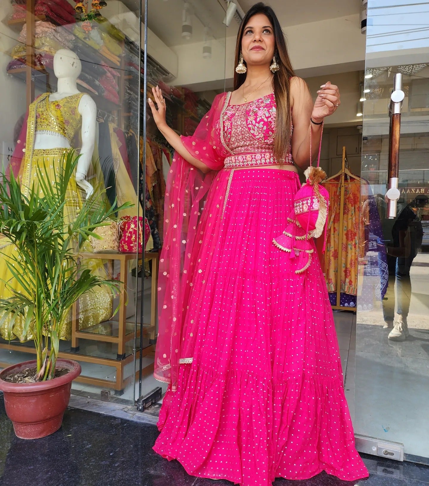 MOUNI HOT PINK EMBROIDED LEHENGA WITH POTLI
