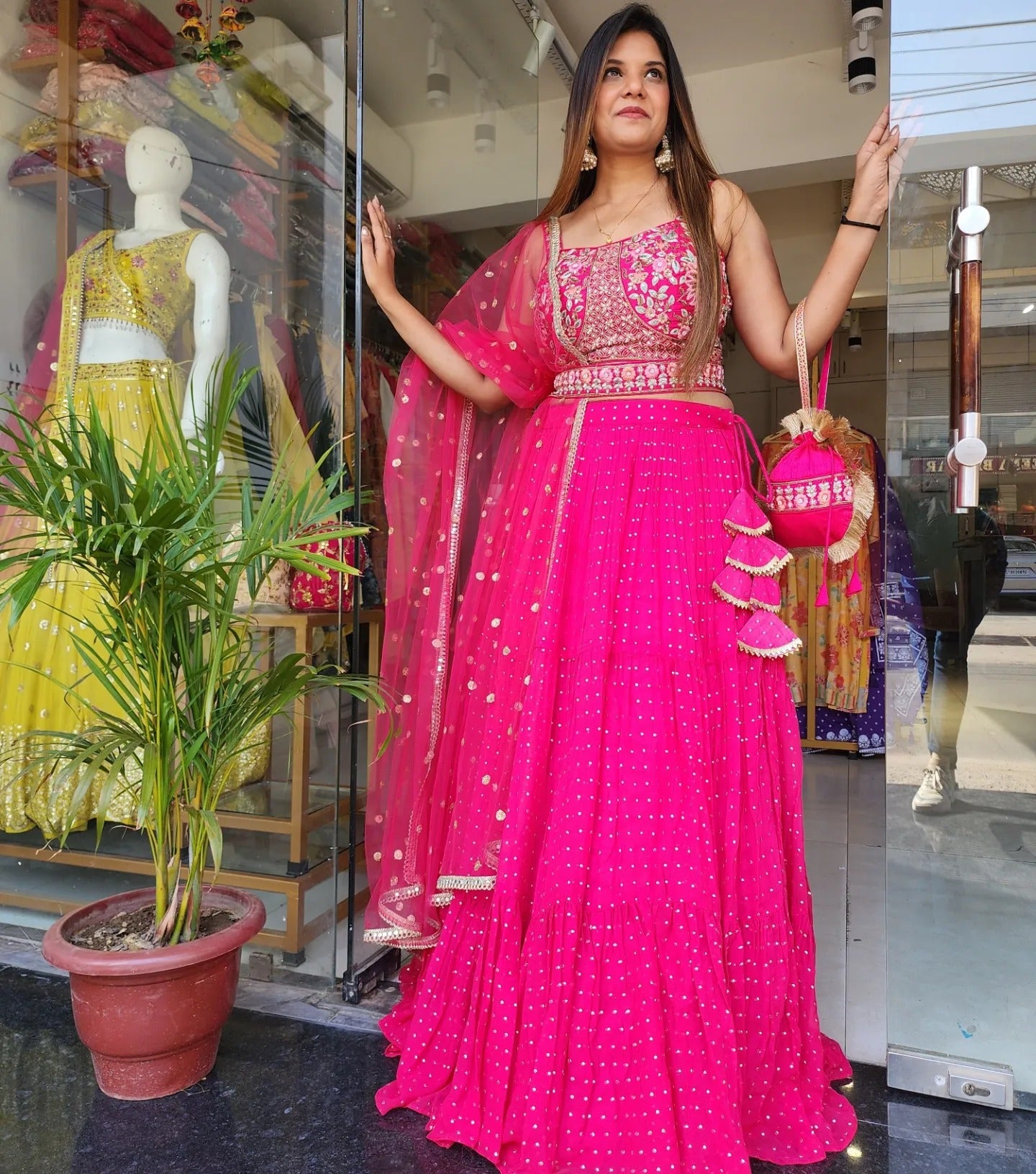 MOUNI HOT PINK EMBROIDED LEHENGA WITH POTLI