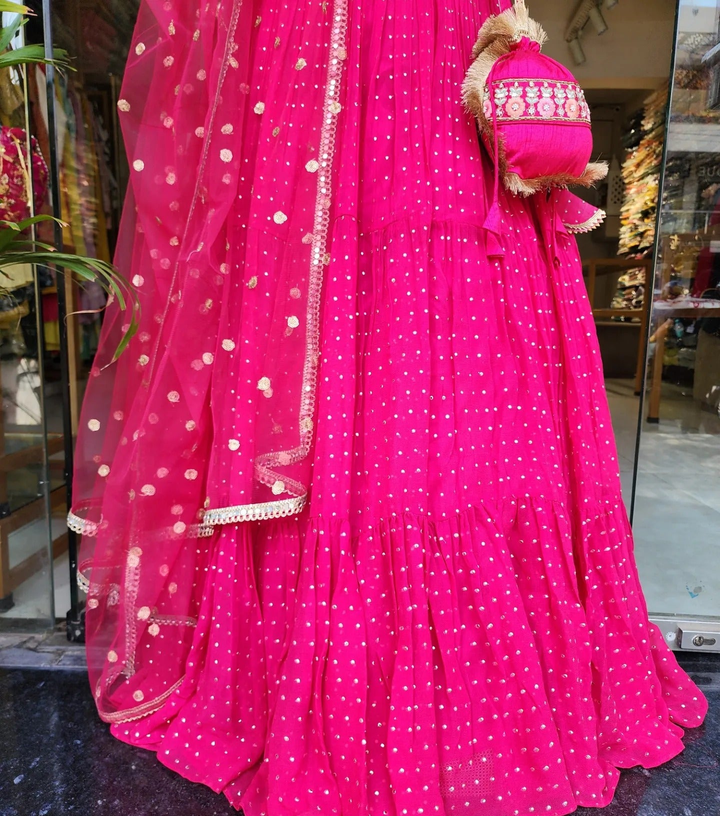 MOUNI HOT PINK EMBROIDED LEHENGA WITH POTLI