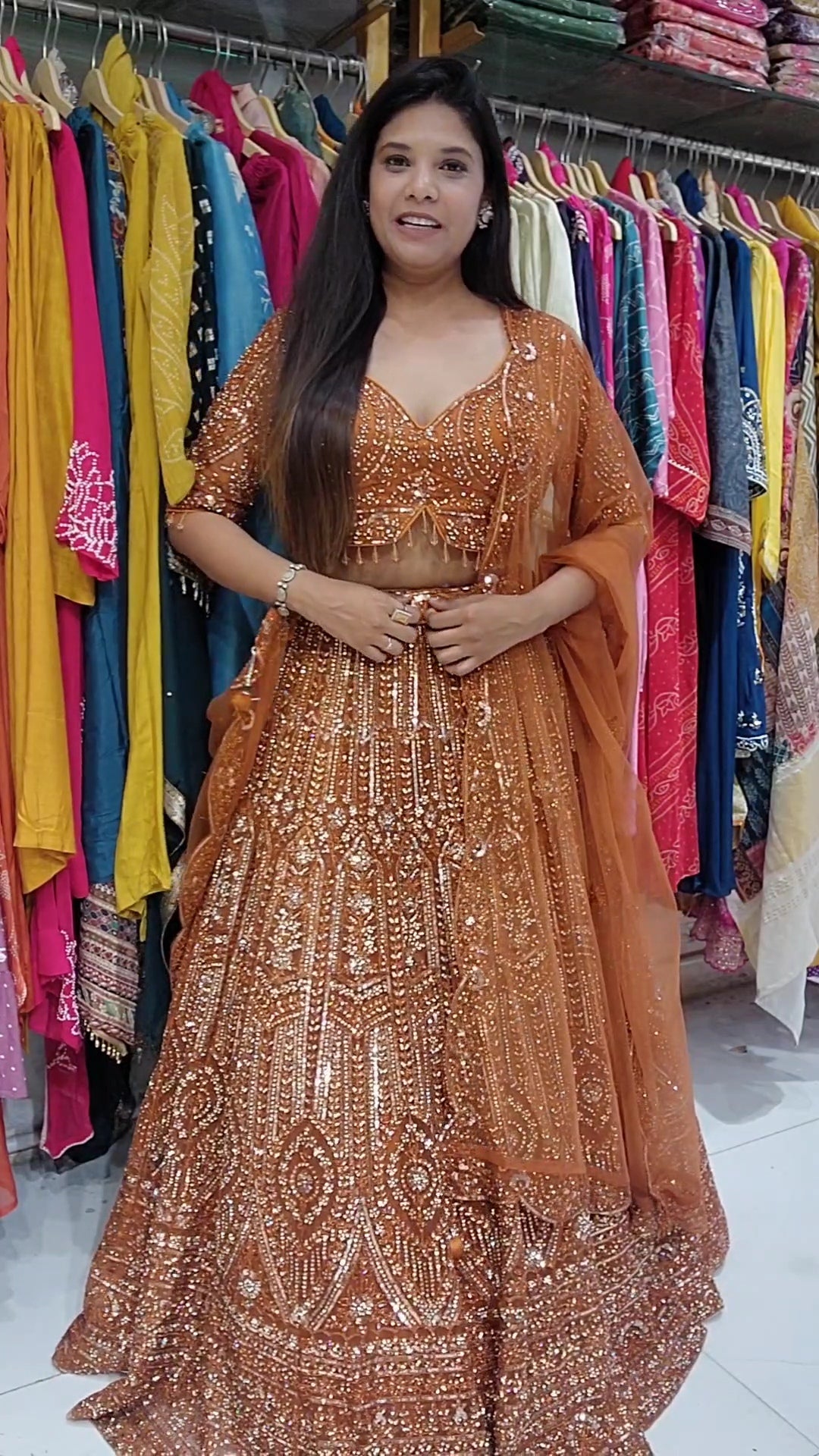 Rust orange aariwork stone embellished lehenga set