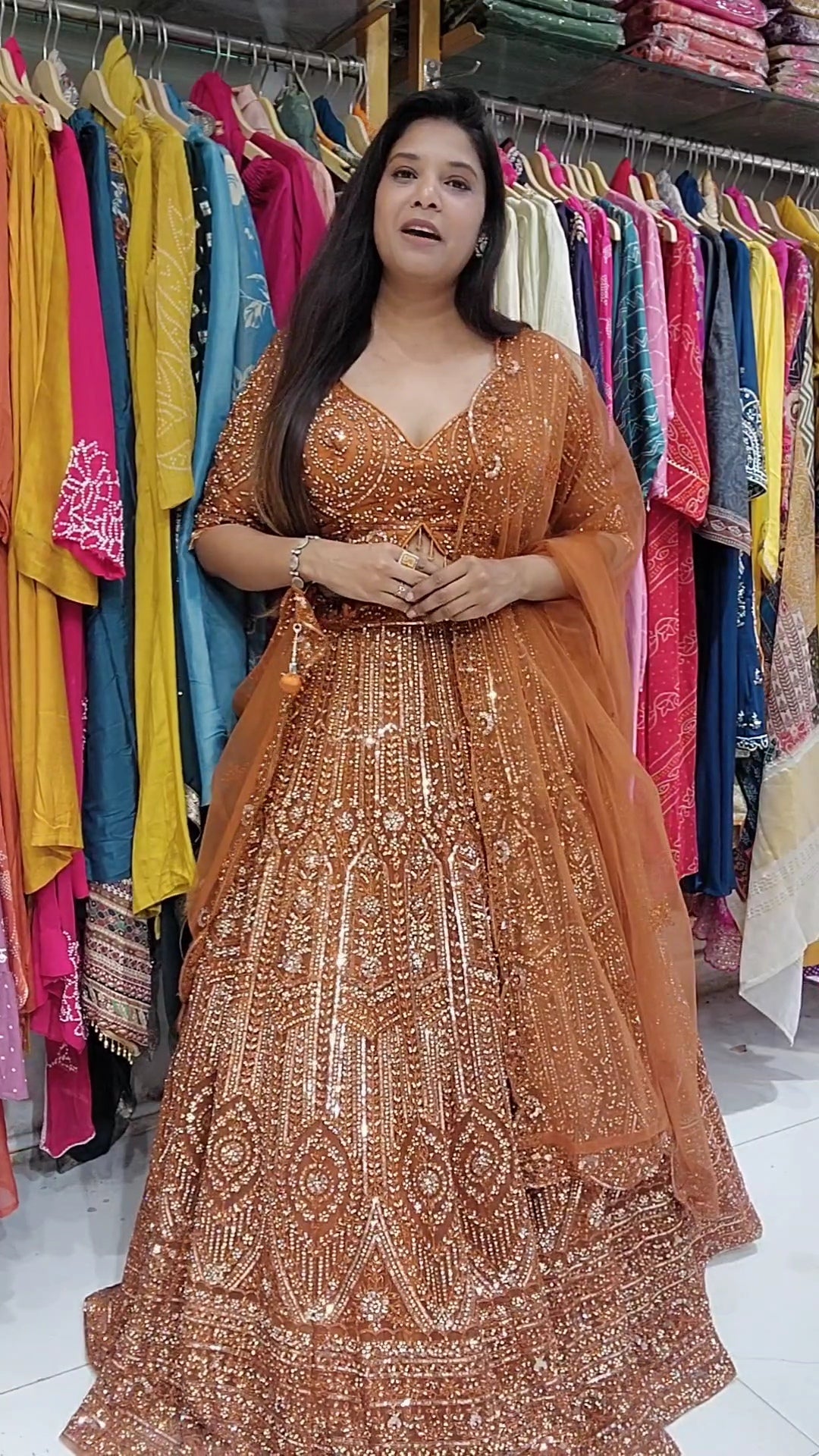 Rust orange aariwork stone embellished lehenga set
