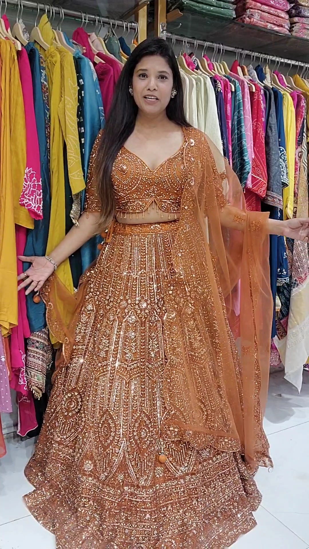 Rust orange aariwork stone embellished lehenga set