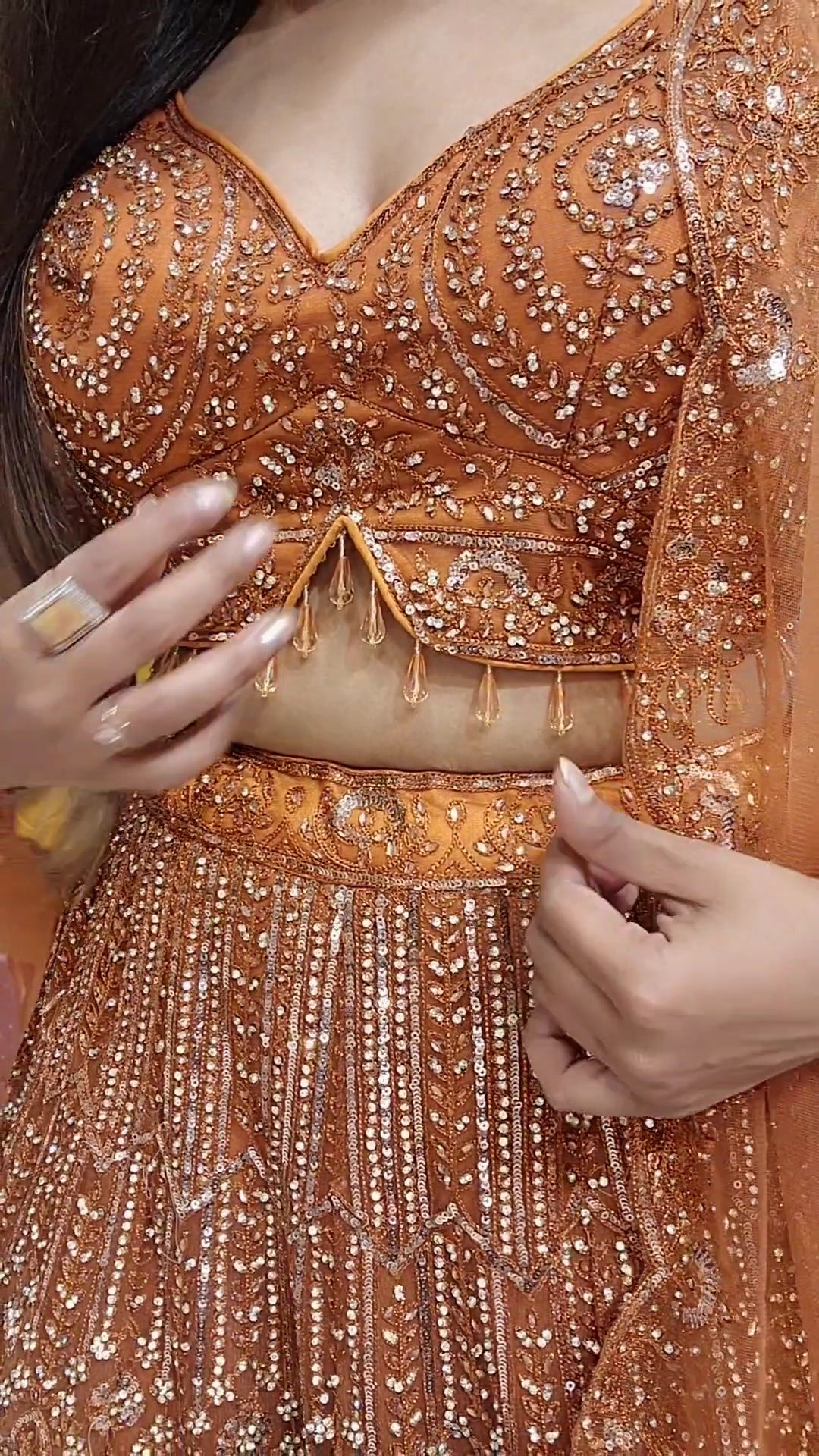 Rust orange aariwork stone embellished lehenga set