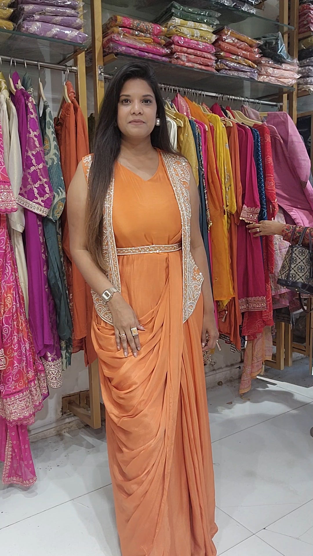 Orange one piece drape with jacket and belt