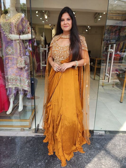 Golden orange drape lehemga with cape