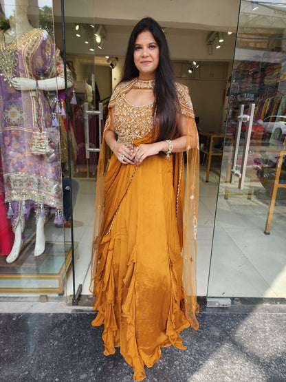 Golden orange drape lehemga with cape