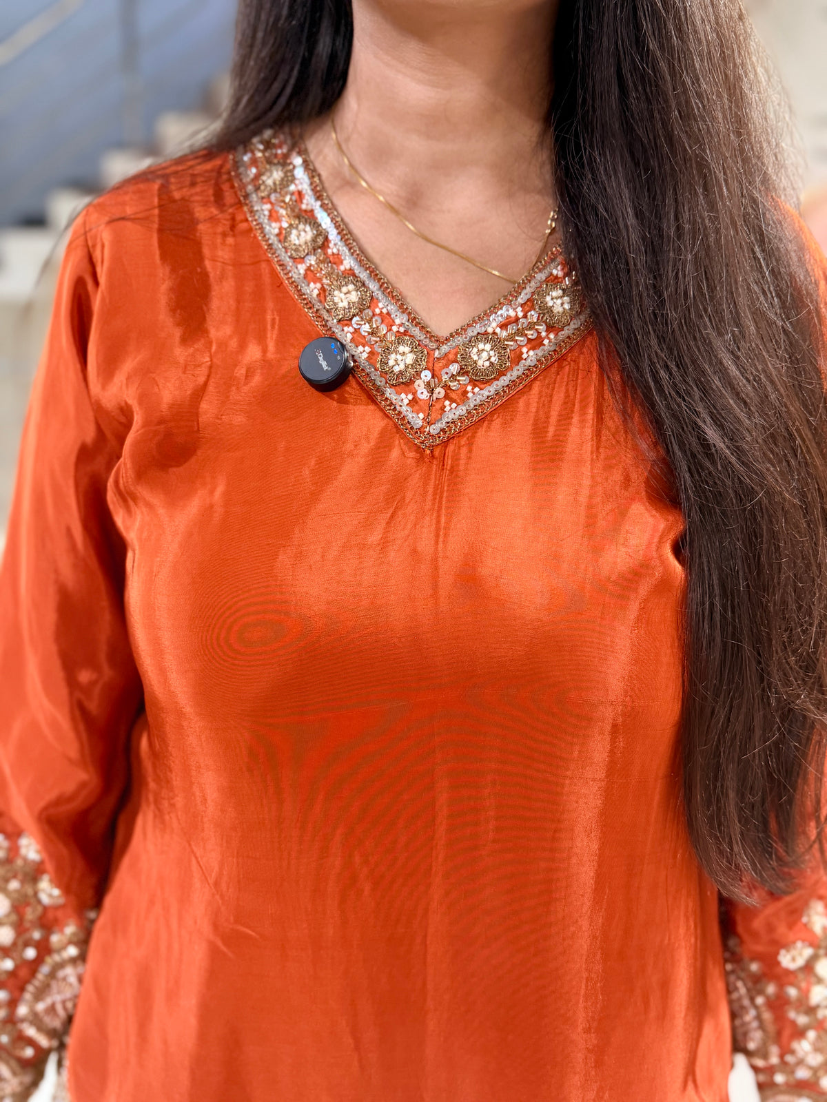 Rust orange crepe embellished sharara suit with purse