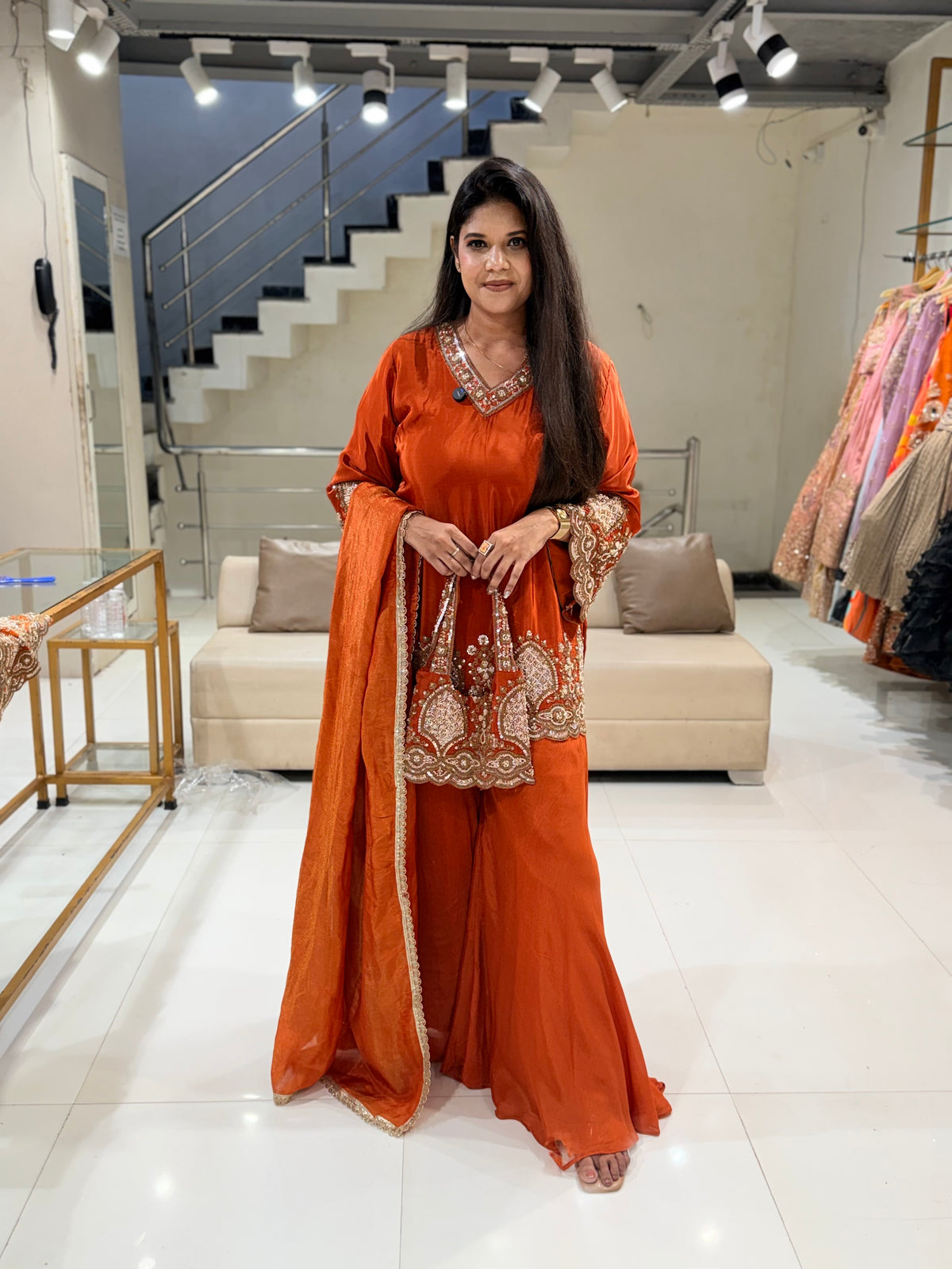 Rust orange crepe embellished sharara suit with purse